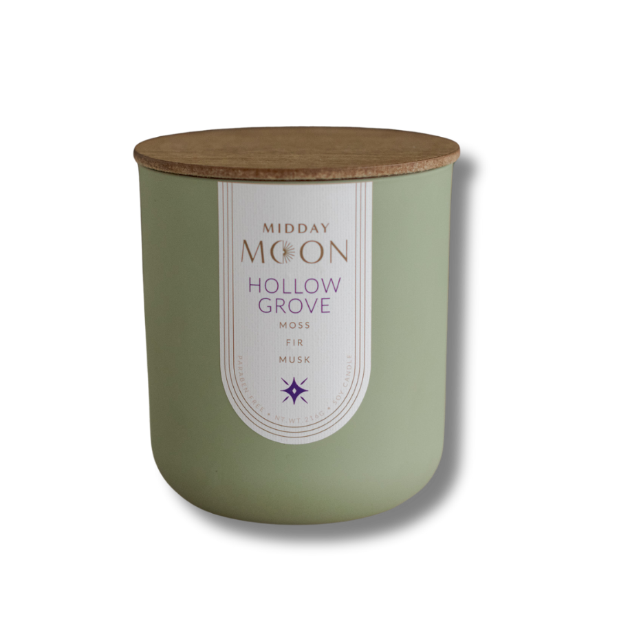 A moss, fir, and musk scented candle in a green jar on a transparent background.