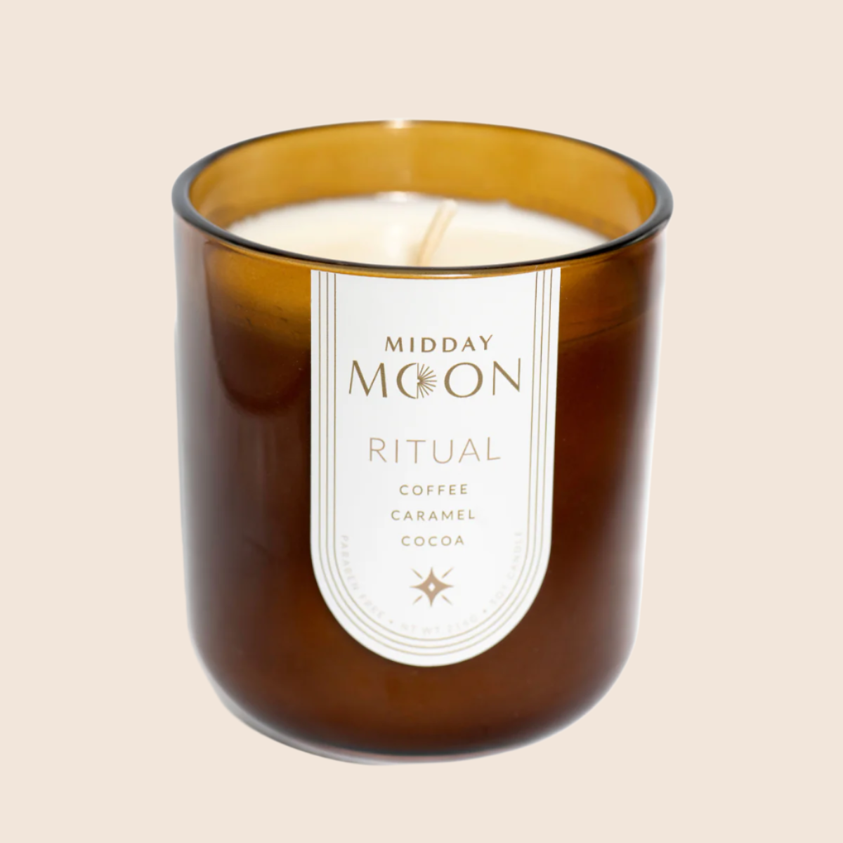 Ritual scented candle on a plain backdrop. Coffee fragrance candle.