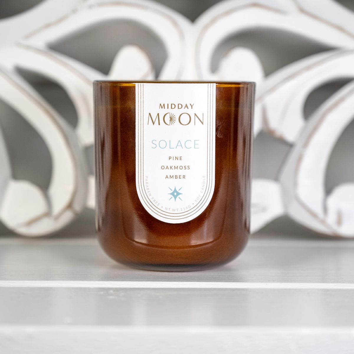 midday moon soy candle. Scented soy candle smells like pine, oakmoss, and amber.