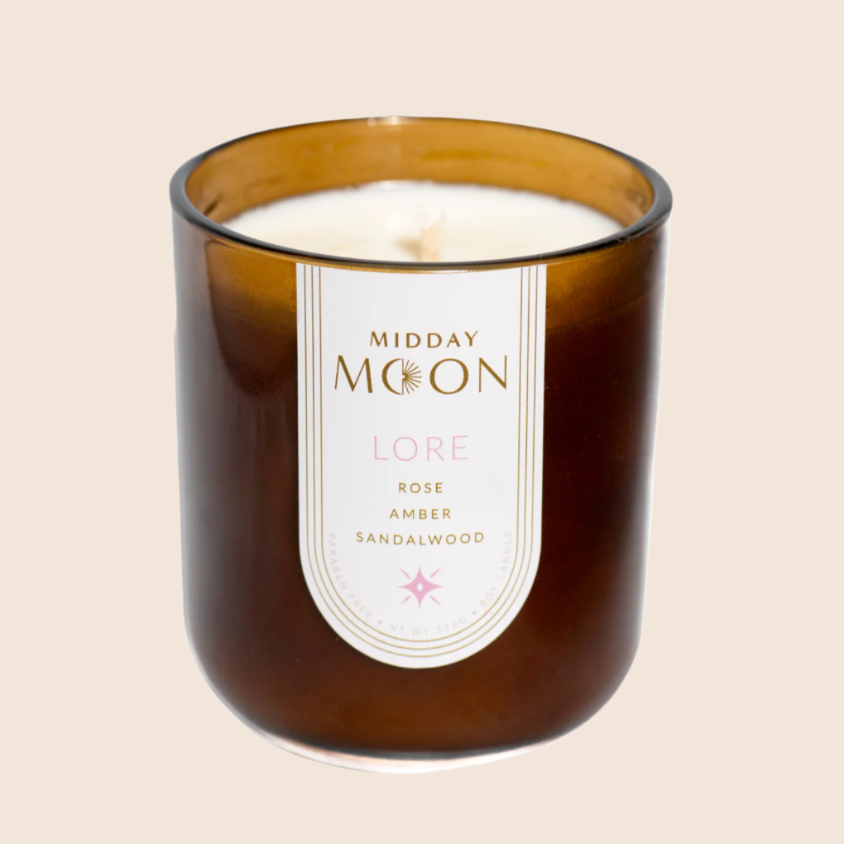 Lore handmade soy candle on a plain backdrop. Rose scented candle. 
