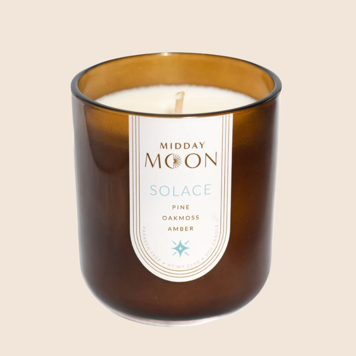 Solace scented soy candle on a plain background. Pine, oakmoss, and amber scented candle.
